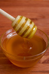 Wooden honey stick to extract honey