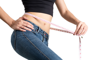 asian woman measuring her waist.