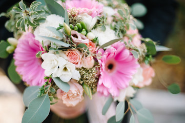 Groom holding a wedding bouquet