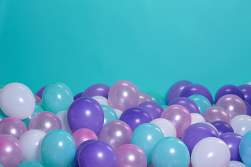 turquoise background with balloons