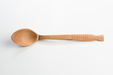 Wooden spoon on white background