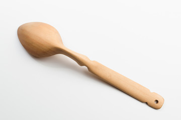 Wooden spoon on white background