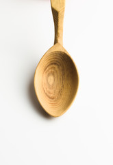 Wooden spoon on white background
