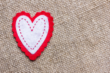 Heart shape made with cotton on linen fabric. Valentine background.