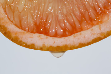 A closeup shot of a pink grapefruit. 