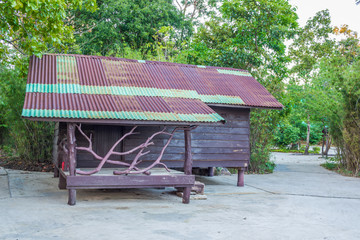 Wooden cabin & trees background  in a temple - Thai tradition