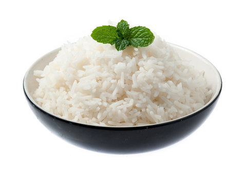 bowl full of rice with mint on white background