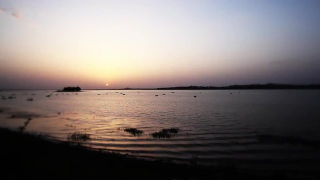 Zoom in shot of a lake at sunset, Bhopal, Madhya Pradesh, India