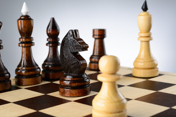 The opposition of white and black chess pieces