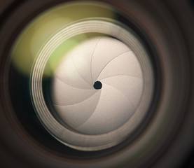 Lens front side exposed aperture blades