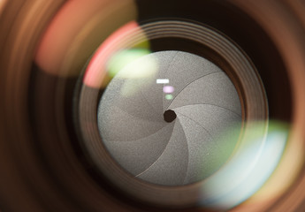 Lens front side exposed aperture blades