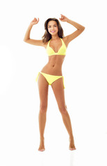 Sexy young brunette woman posing in a bikini.Beautiful perfect f