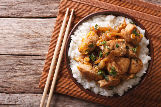 Traditional oyakodon and rice in a bowl. horizontal top view
