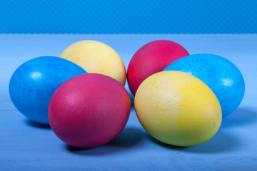 Fototapeta na wymiar Easter eggs on blue background