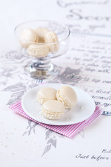 Fototapeta na wymiar Coconut Macarons with White Chocolate Cream Cheese Filling