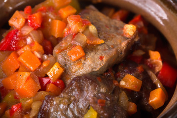 Pot roast pork meat with minced vegetables.