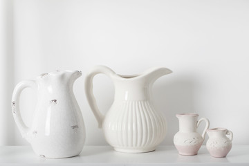 milk jugs on white background