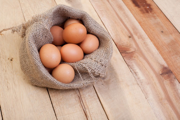 Egg, Chicken Egg in sack on wood background