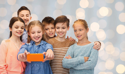 happy children talking selfie by smartphone