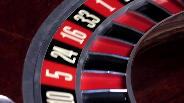 Roulette wheel running and stops with fallen white ball 
