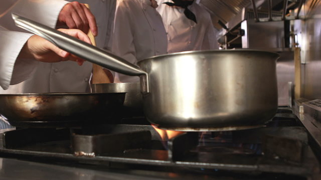 Several cooks preparing food