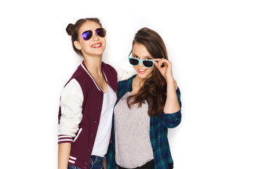 happy smiling pretty teenage girls in sunglasses
