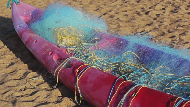 Fisherman's boat and net on the beach