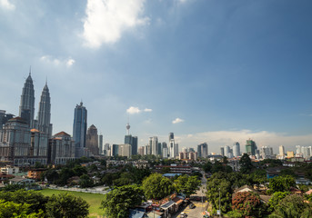 Naklejka na ściany i meble KUALA LUMPUR, MALAYSIA - 11TH JANUARY 2016; View of downtown Kuala Lumpur, Malaysia (called simply KL by locals). KL is a busy city with skyscrapers,colonial architecture and lots of greenery.