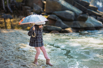 the girl with an umbrella in the rain