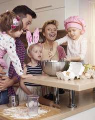 Cheerful family spending time in the kitchen