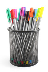 colored Pens  in iron basket on the white background
