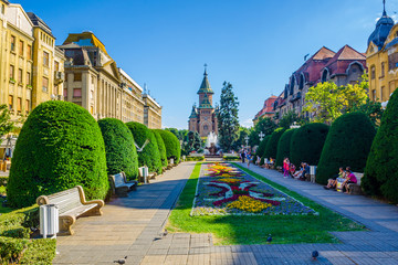 Victory square - piata victoriei - timisoara is a long square with green park surrounded by...