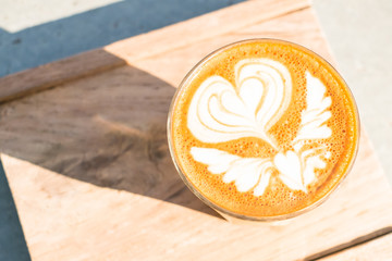 Latte Art, Cup of coffee on wooden tray background