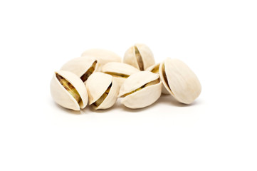 Salted pistachio nuts isolated on white background