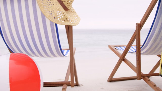 View of deckchairs on the beach