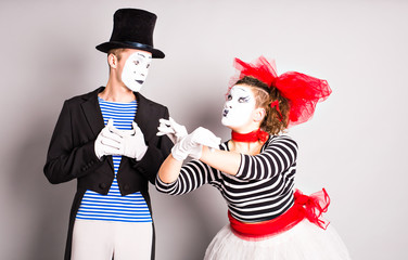 Street artists performing, Two mimes man and  woman in april fools day