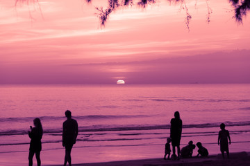 Fototapeta premium Siluate or Silhouette of people who spent time in the sea sand a