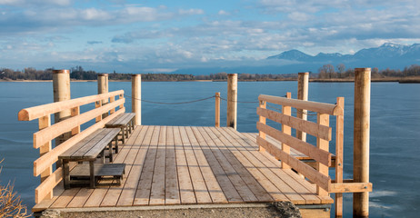new build wooden brige on frozen lake Chiemsee