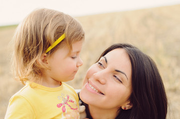 Smiling Mother and Daughter