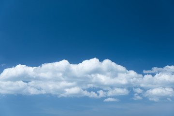 Naklejka na ściany i meble Vibrant blue sky with beautiful white cloud