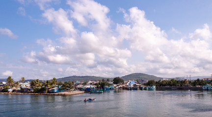 Fototapeta na wymiar Fishermans come back in seaport of town Duong Dong, Vietnam.