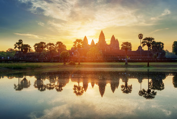Mysterious towers of ancient Angkor Wat in Cambodia at sunrise