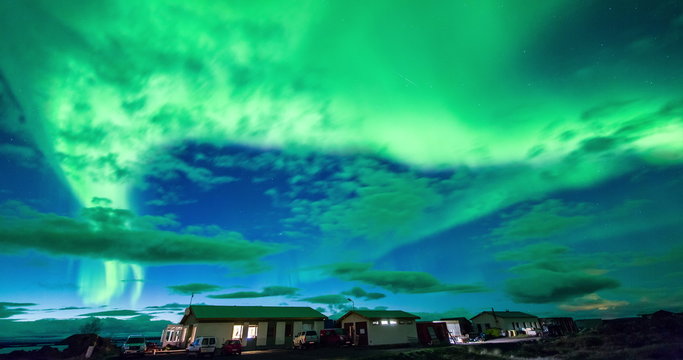 Aurora Borealis over houses in Iceland