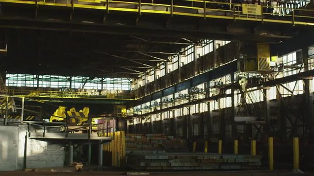 Timelapse of Electromagnet Cranes working in Industrial Environment. Shot on RED Cinema Camera.