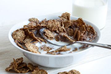 Wheat bran breakfast cereal in bowl.