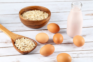 Fototapeta na wymiar raw organic brown eggs with oatmeal