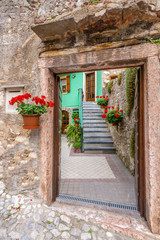 Entrance of an old apartment building in Malcesine, Italy.