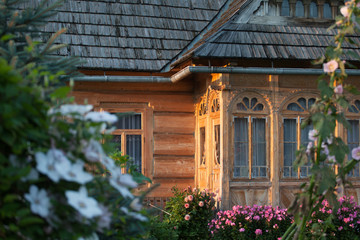 Fototapeta na wymiar Log house with a shingle roof. Podhale, southern Poland