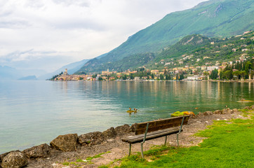 Walkpath along beautiful peaceful lake Garda, Italy