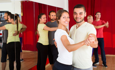 Beautiful woman dancing with man